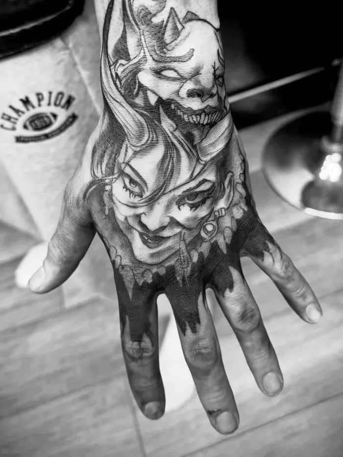 Black and Grey Hand Tattoo